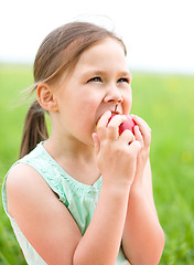 Image showing Portrait of a little girl with apple