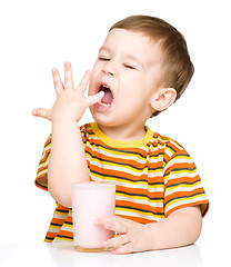 Image showing Cute little boy with a glass of milk