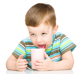 Image showing Cute little boy with a glass of milk