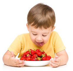 Image showing Little boy with strawberries