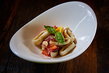 Image showing healthy rings squid salad with tomatoes