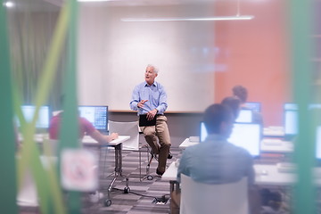 Image showing teacher and students in computer lab classroom