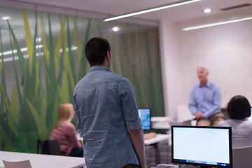 Image showing student answering a question in classroom