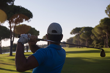 Image showing golf player hitting shot