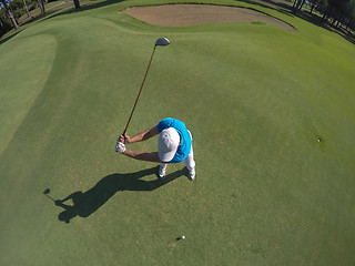 Image showing top view of golf player hitting shot