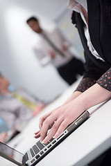 Image showing woman hands typing on laptop keyboard at business meeting