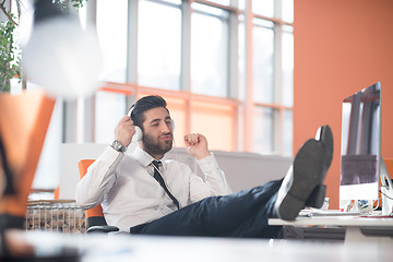 Image showing relaxed young business man at office