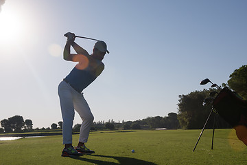 Image showing golf player hitting shot