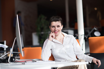 Image showing happy young business woman relaxing and geting insiration