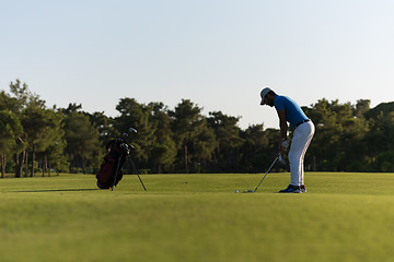 Image showing golfer hitting long shot