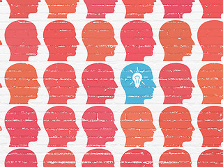 Image showing Business concept: head with light bulb icon on wall background