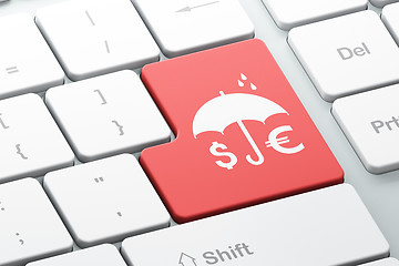 Image showing Security concept: Money And Umbrella on computer keyboard background