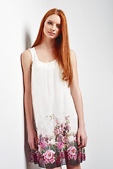 Image showing Beautiful female in sleeveless flower print summer dress 