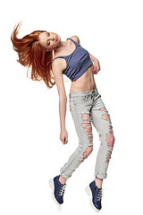 Image showing Hip-hop style teenage girl jumping dancing