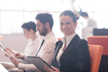 Image showing business woman on meeting  using tablet