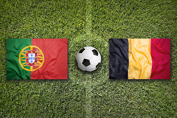 Image showing Portugal vs. Belgium flags on soccer field