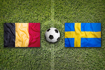 Image showing Belgium vs. Sweden flags on soccer field