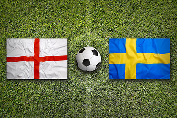 Image showing England vs. Sweden flags on soccer field