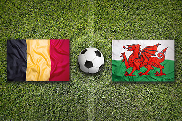 Image showing Belgium vs. Wales flags on soccer field