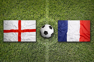 Image showing England vs. France flags on soccer field