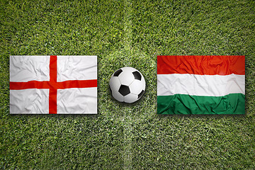 Image showing England vs. Hungary flags on soccer field