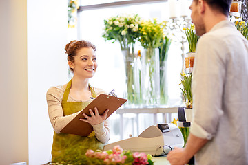 Image showing florist woman and man making order at flower shop