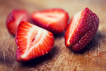 Image showing close up of ripe red strawberries on cutting board