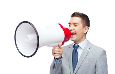 Image showing happy businessman in suit speaking to megaphone