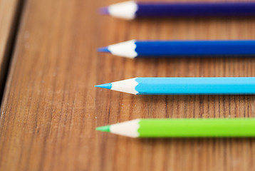 Image showing close up of crayons or color pencils on wood