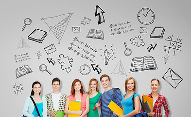 Image showing group of teenage students with folders and bags