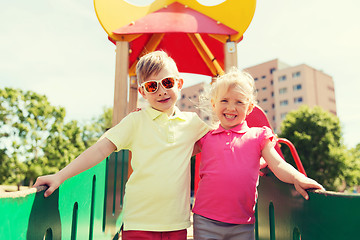 Image showing two happy kids hugging on children playground