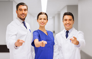 Image showing group of medics pointing finger on you at hospital