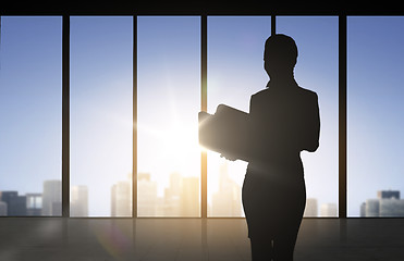 Image showing silhouette of business woman with folders