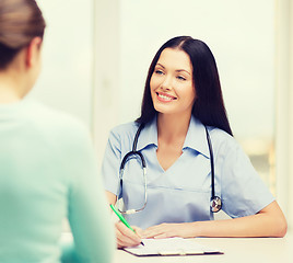 Image showing smiling doctor or nurse with patient