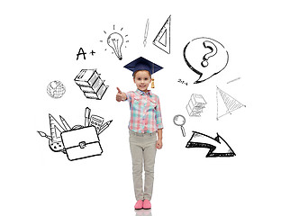 Image showing happy girl in bachelor hat showing thumbs up