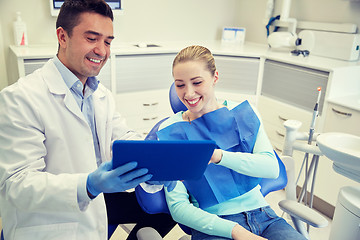 Image showing male dentist with tablet pc and woman patient