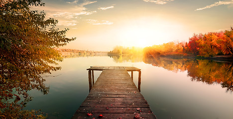 Image showing Red autumn and fishing pier