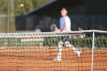 Image showing Tennis net Man plays tennis