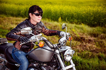 Image showing Biker girl on a motorcycle