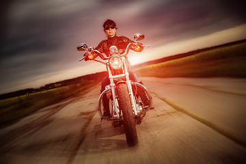 Image showing Biker girl on a motorcycle