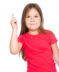 Image showing Cute little girl is pointing up