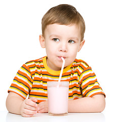 Image showing Cute little boy with a glass of milk