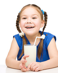 Image showing Cute little girl with a glass of milk