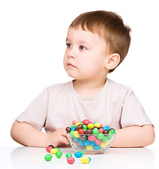 Image showing Portrait of a boy with candies