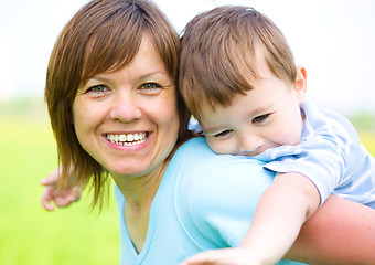 Image showing Mother is playing with her son