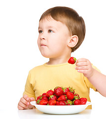 Image showing Little boy with strawberries