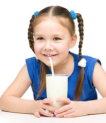 Image showing Cute little girl with a glass of milk