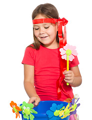 Image showing Cute little girl wit a bunch of flowers