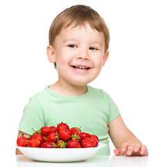 Image showing Happy little boy with strawberries