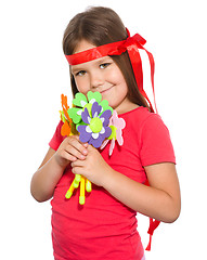 Image showing Cute little girl wit a bunch of flowers